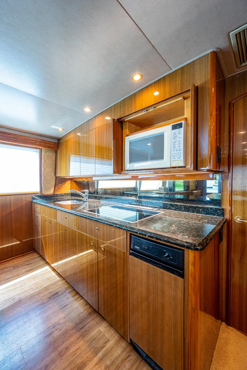 Slide: The Image of Viking 74 Convertible Reel Estate - Galley, Cooktop, Microwave - 7