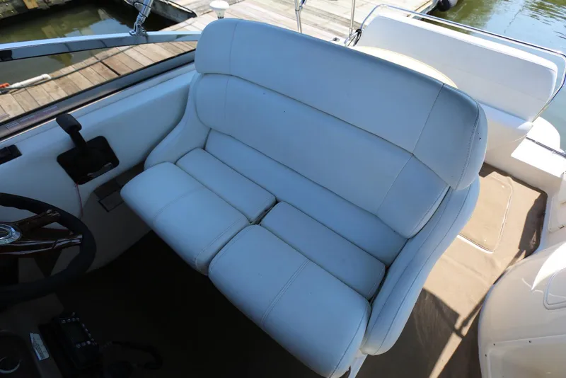 Slide: The Image of White leather seating on 2005 Regal Commodore 2665 boat, dockside view. - 15