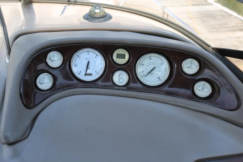 Slide: The Image of Dashboard of 2005 Regal Commodore 2665 boat with gauges and controls. - 16