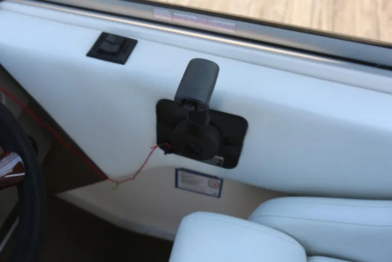 Slide: The Image of Interior view of a 2005 Regal Commodore 2665 boat control panel. - 18