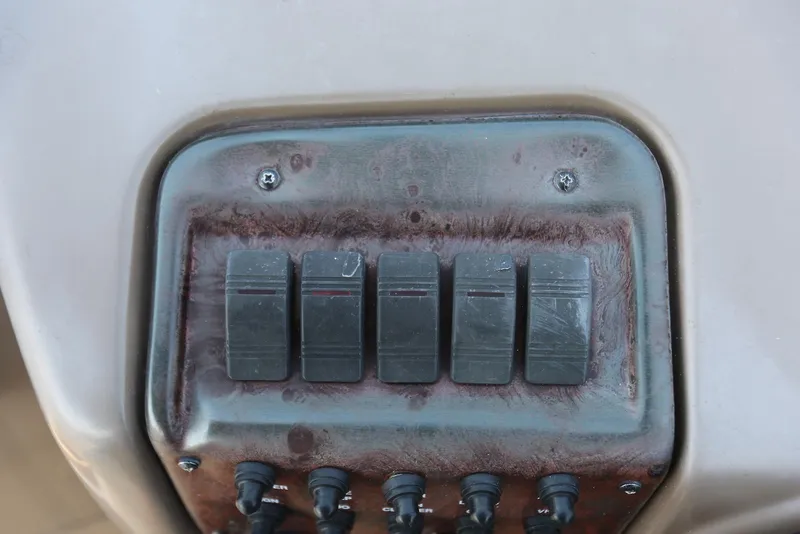 Slide: The Image of Control panel of a 2005 Regal Commodore 2665 boat with four switches. - 21