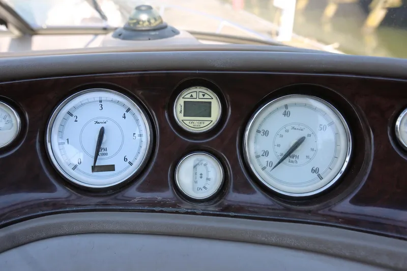 Slide: The Image of Dashboard of 2005 Regal Commodore 2665 with RPM and speed gauges. - 24