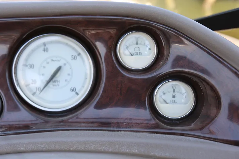 Slide: The Image of Dashboard of 2005 Regal Commodore 2665 with speedometer, voltmeter, and fuel gauge. - 25