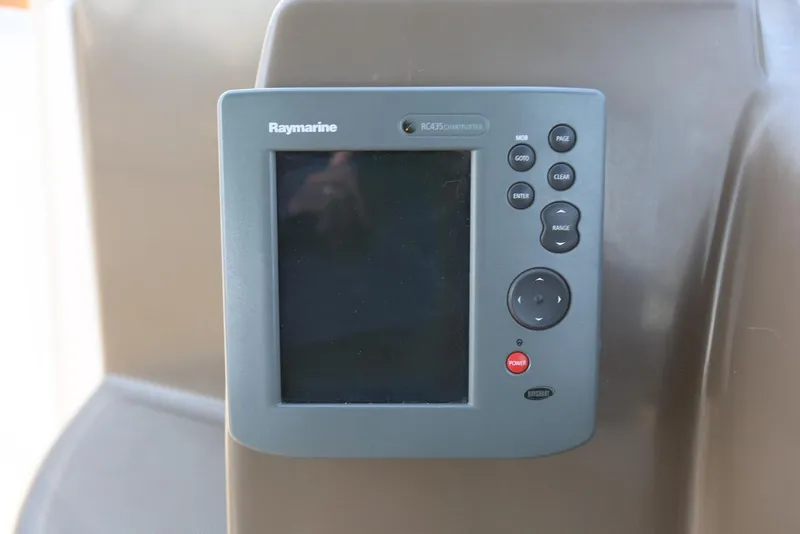 Slide: The Image of Raymarine RCA35 chartplotter on 2005 Regal Commodore 2665 boat dashboard. - 26