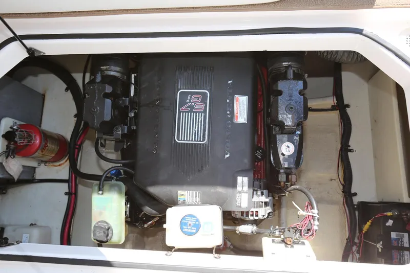 Slide: The Image of Engine compartment of 2005 Regal Commodore 2665 boat, featuring a 5.7 GXi engine. - 32