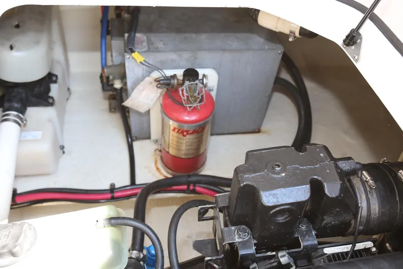 Slide: The Image of Engine compartment of 2005 Regal Commodore 2665 with fire extinguisher and wiring. - 33