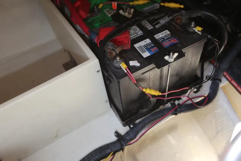 Slide: The Image of Battery compartment of a 2005 Regal Commodore 2665 boat, showing wiring connections. - 34