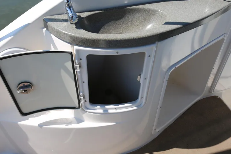 Slide: The Image of 2005 Regal Commodore 2665 boat sink with open storage compartments. - 45
