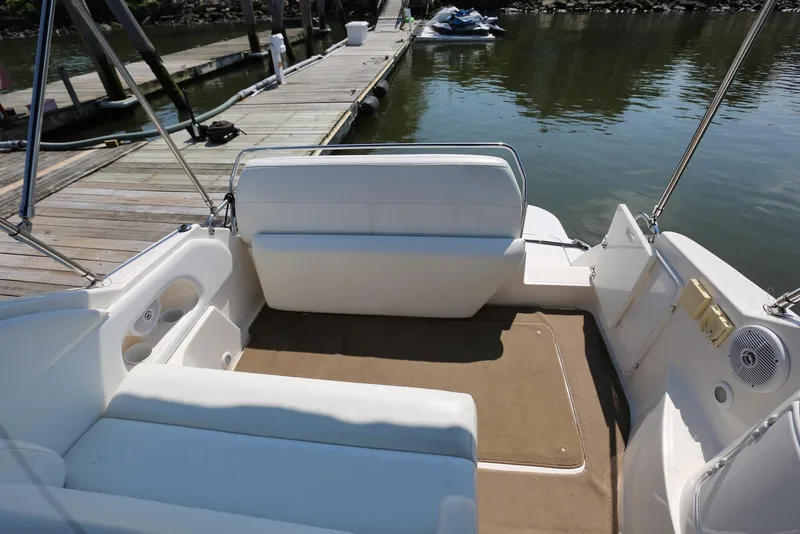 Slide: The Image of 2005 Regal Commodore 2665 boat interior with seating, docked by the water. - 47
