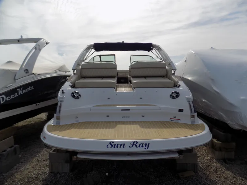 Slide: The Image of 2019 Regal 2800 Bowrider boat named "Sun Ray" on display, rear view. - 3