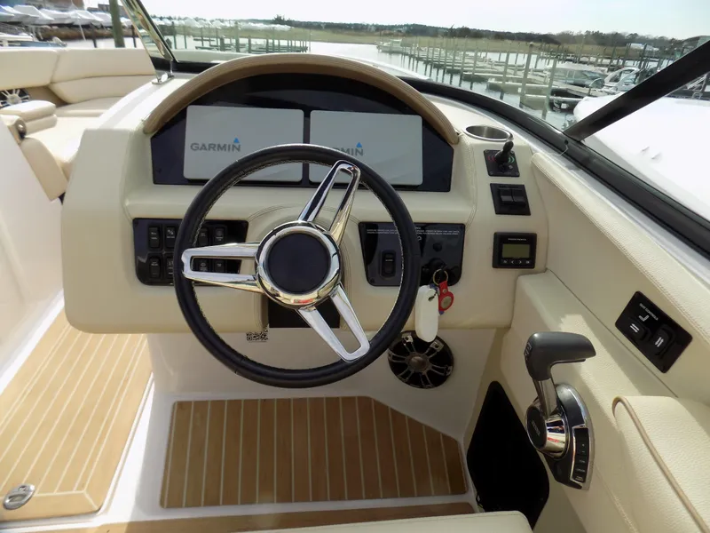 Slide: The Image of Cockpit of 2019 Regal 2800 Bowrider with Garmin displays and modern steering wheel. - 6