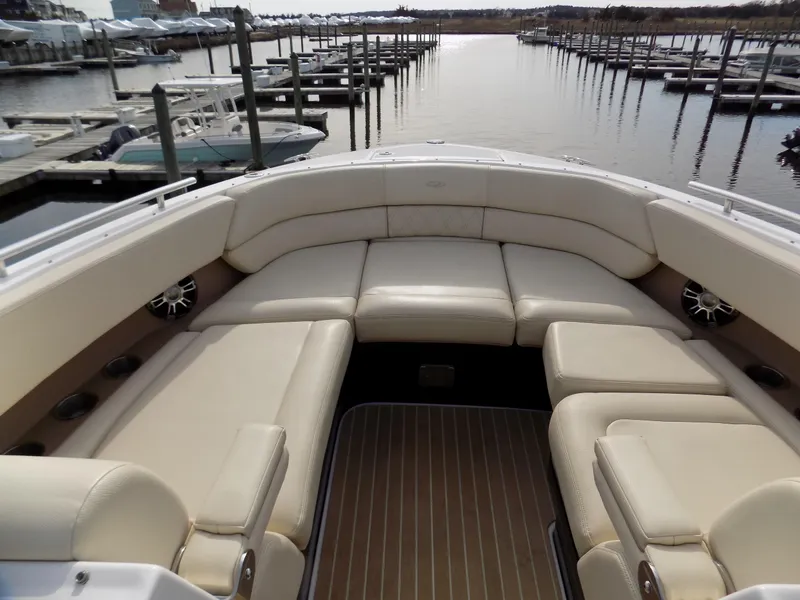 Slide: The Image of 2019 Regal 2800 Bowrider with spacious seating, docked at a marina. - 7