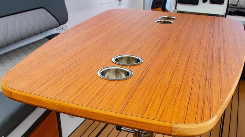 Slide: The Image of Wooden table with cup holders on the 2023 Alfastreet 21 Open boat. - 28