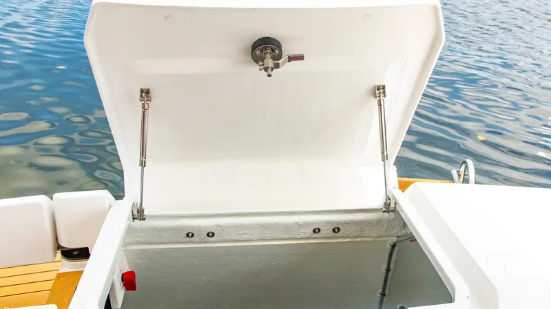 Slide: The Image of 2023 Alfastreet 21 Open boat storage compartment open by the water. - 34
