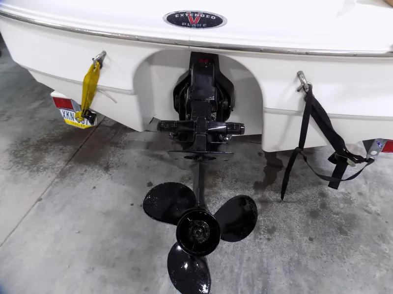 Slide: The Image of Rear view of a 2001 Chaparral 216 SSi boat with propeller and trailer. - 12