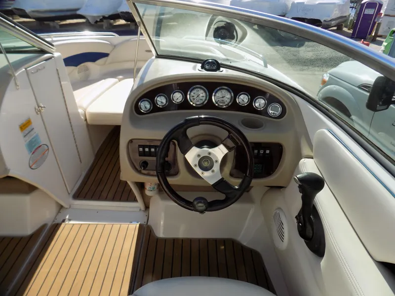 Slide: The Image of 2001 Chaparral 216 SSi boat interior with steering wheel and dashboard controls. - 4