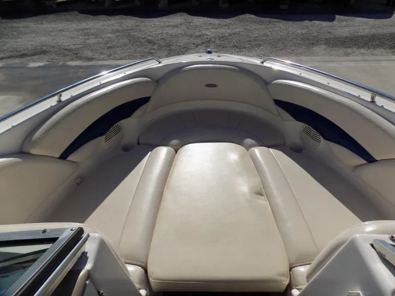 Slide: The Image of 2001 Chaparral 216 SSi boat interior with beige seating and blue accents. - 5