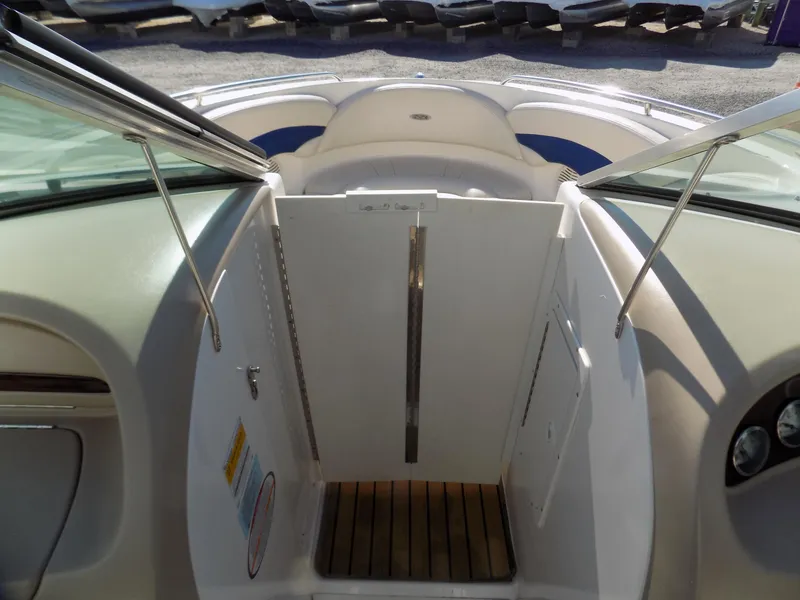Slide: The Image of 2001 Chaparral 216 SSi boat interior with open hatch and wooden flooring. - 6