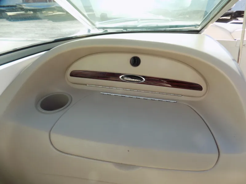 Slide: The Image of Dashboard of a 2001 Chaparral 216 SSi boat with storage compartment and cup holder. - 7