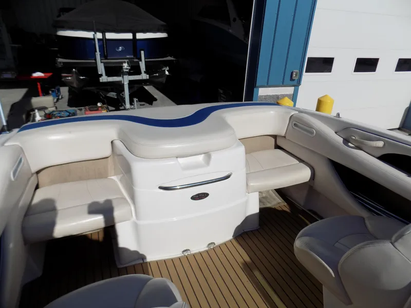 Slide: The Image of Interior view of a 2001 Chaparral 216 SSi boat with seating and storage. - 8