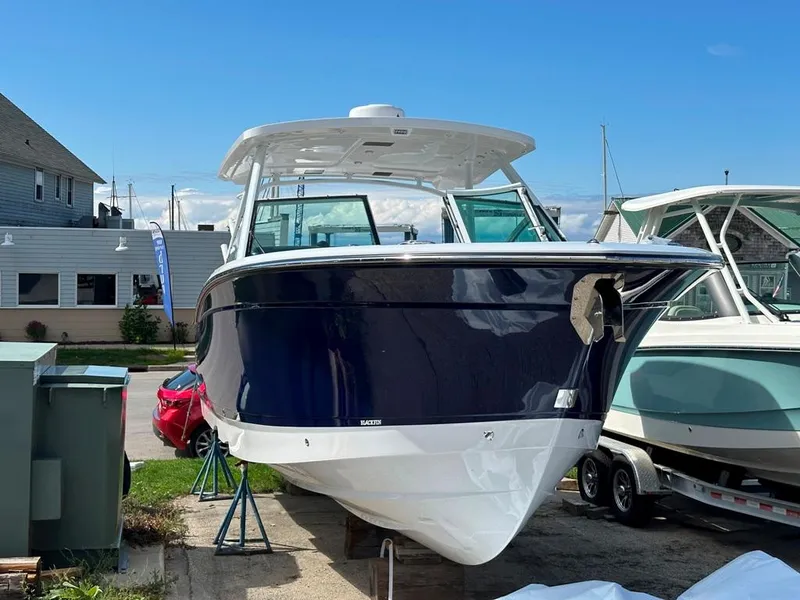 The Image of 2024 Blackfin 302 DC boat on display at a marina. - 0