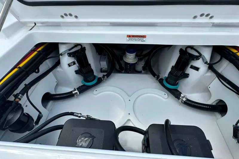 Slide: The Image of Engine compartment of a 2024 Blackfin 302 DC boat with visible components. - 10