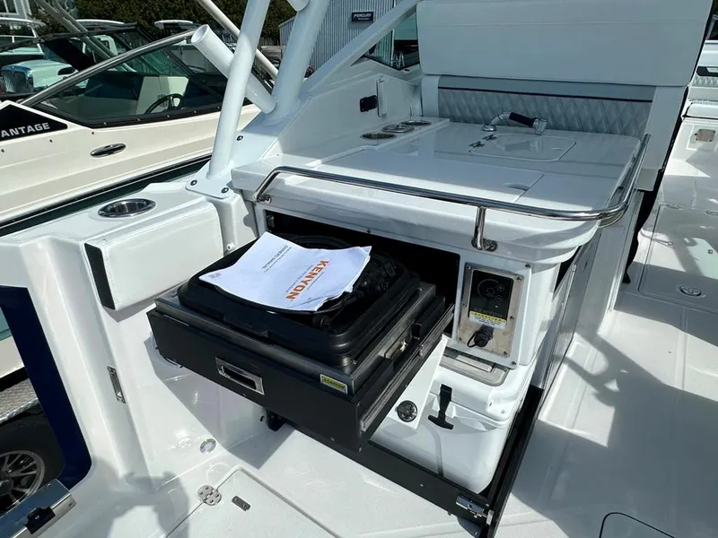Slide: The Image of 2024 Blackfin 302 DC boat interior with storage compartment open. - 17