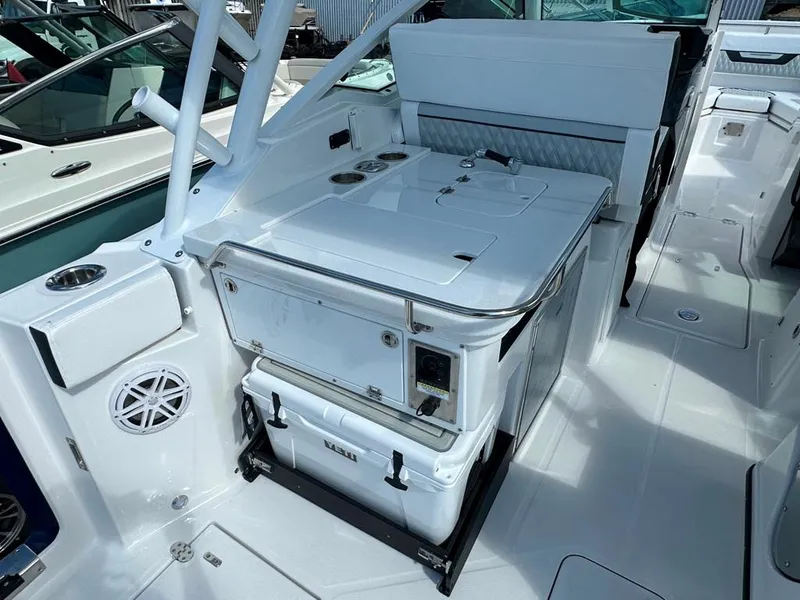 Slide: The Image of 2024 Blackfin 302 DC boat interior with seating and storage compartments. - 18