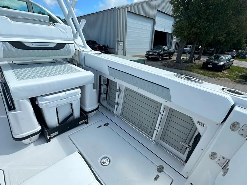 Slide: The Image of 2024 Blackfin 302 DC boat interior with storage compartments and seating. - 25
