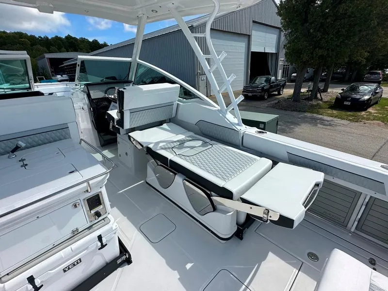 Slide: The Image of 2024 Blackfin 302 DC boat interior with seating and storage compartments. - 29
