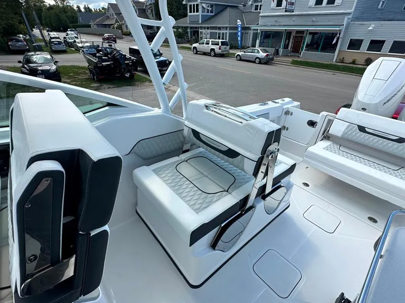 Slide: The Image of 2024 Blackfin 302 DC boat interior with white seating and modern design. - 30