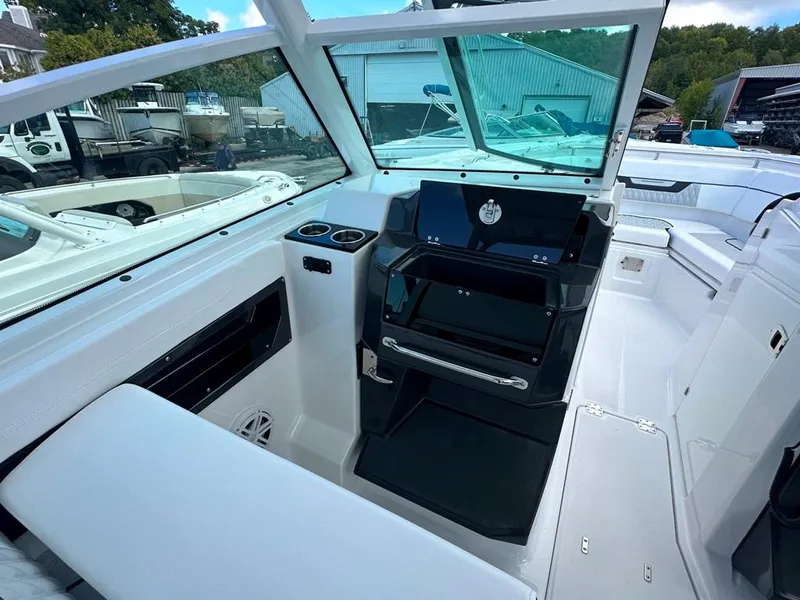 Slide: The Image of 2024 Blackfin 302 DC boat interior with helm station and seating. - 32