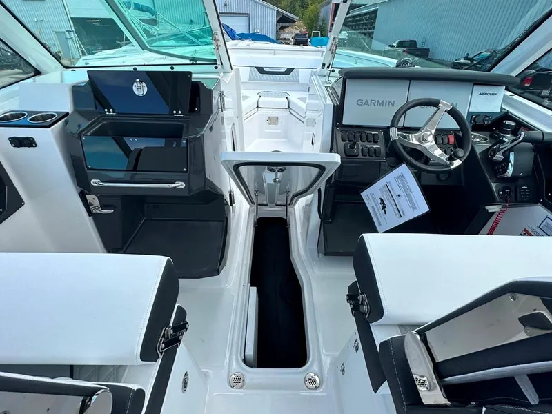 Slide: The Image of 2024 Blackfin 302 DC boat interior with Garmin navigation system. - 33