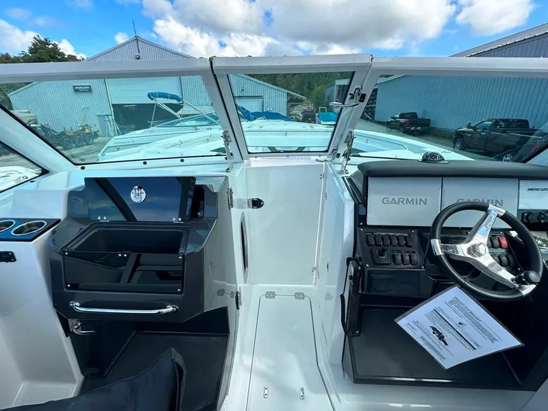 Slide: The Image of 2024 Blackfin 302 DC boat cockpit with Garmin navigation system. - 34
