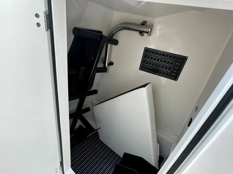 Slide: The Image of 2024 Blackfin 302 DC storage compartment with seating and equipment. - 36