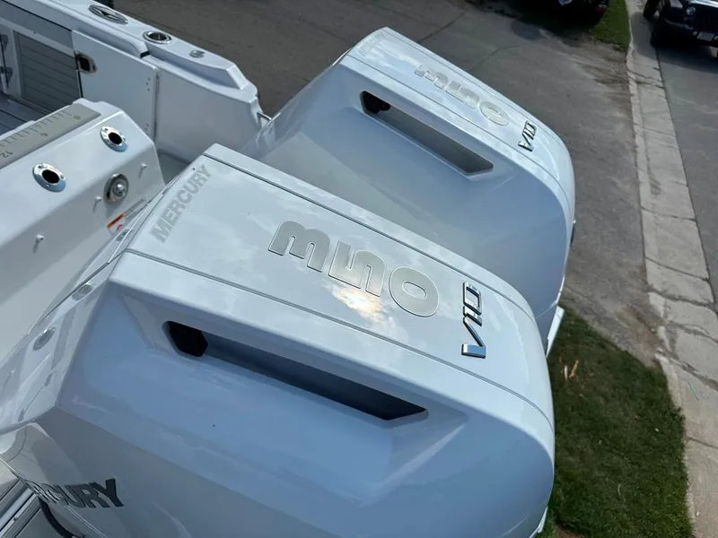 Slide: The Image of Twin Mercury outboard engines on a 2024 Blackfin 302 DC boat. - 5