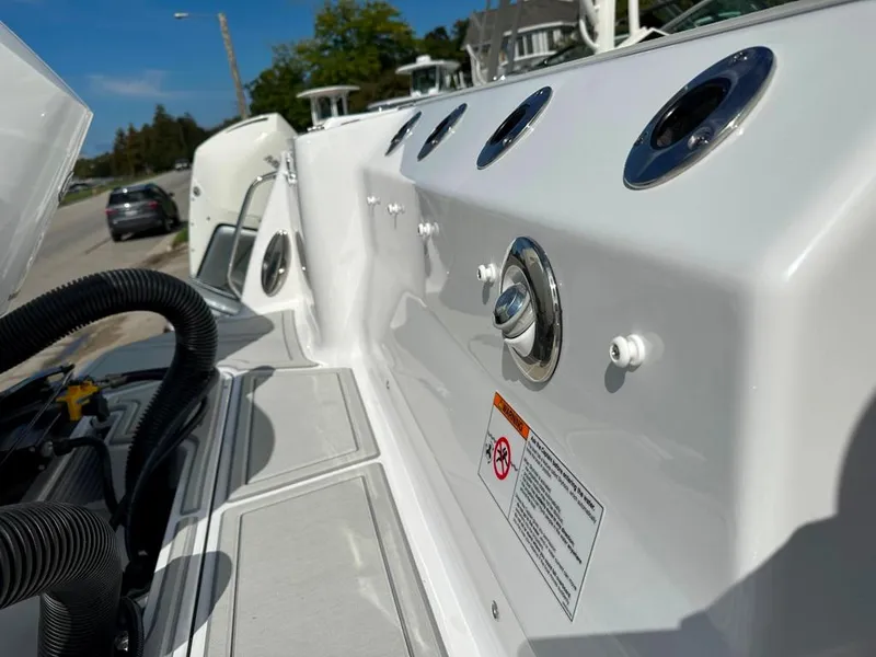 Slide: The Image of 2024 Blackfin 302 DC boat deck with rod holders and control panel. - 7