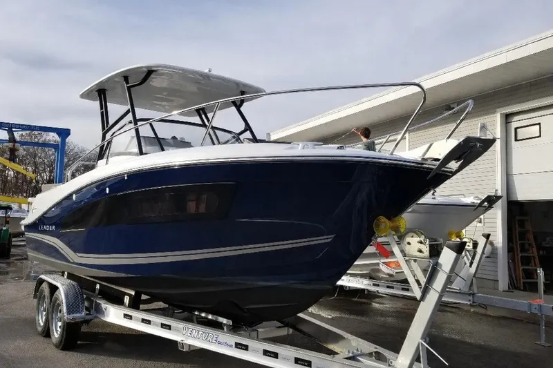 The Image of 2023 Jeanneau Leader 7.5 WA Series 3 boat on trailer, outdoor display. - 0