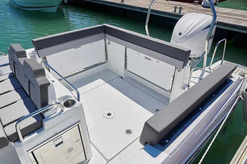 Slide: The Image of 2023 Jeanneau Leader 7.5 WA S3 boat with spacious seating area at the dock. - 9