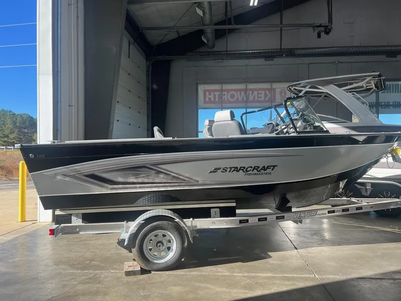 The Image of 2023 Starcraft Fishmaster 196 boat on trailer in a garage. - 0