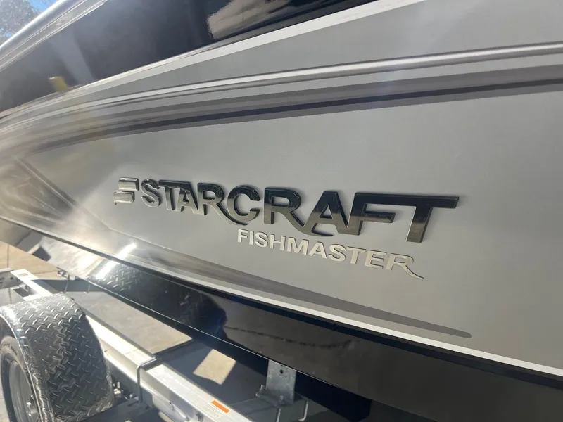 Slide: The Image of 2023 Starcraft Fishmaster 196 boat side view with logo. - 12