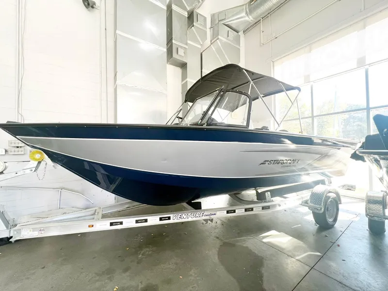 The Image of 2023 Starcraft Fishmaster 196 boat in a showroom. - 0