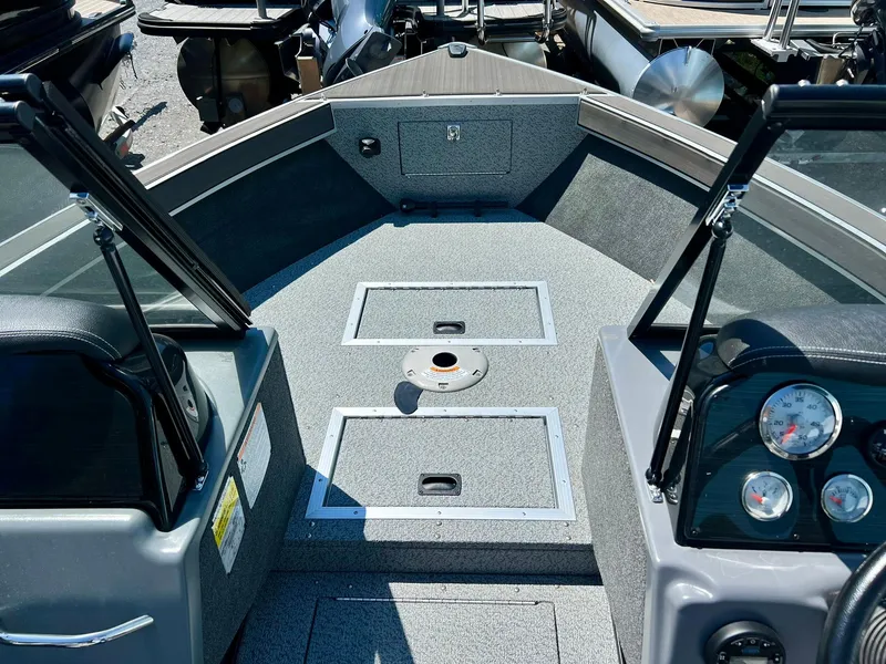 Slide: The Image of Dashboard storage compartment in a 2023 Starcraft Fishmaster 196 boat. - 12
