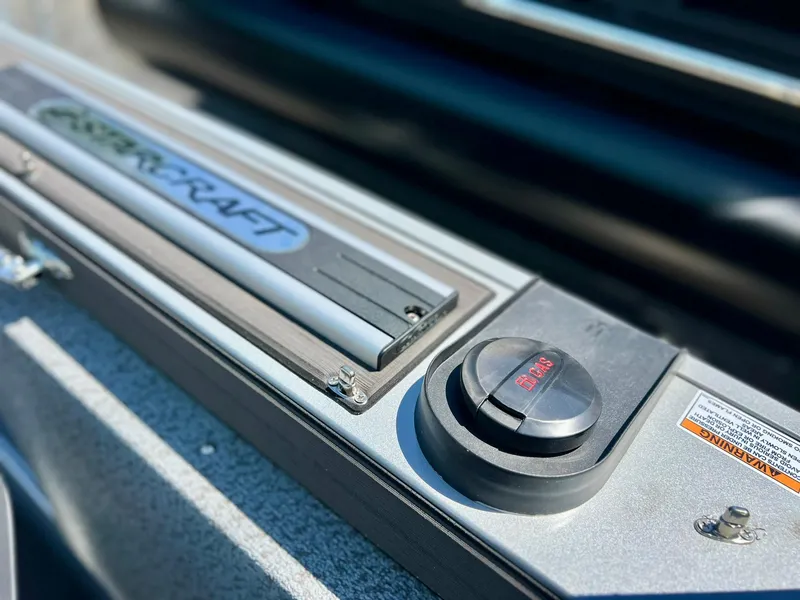 Slide: The Image of 2023 Starcraft Fishmaster 196 boat interior with captain's chair and control panel. - 13