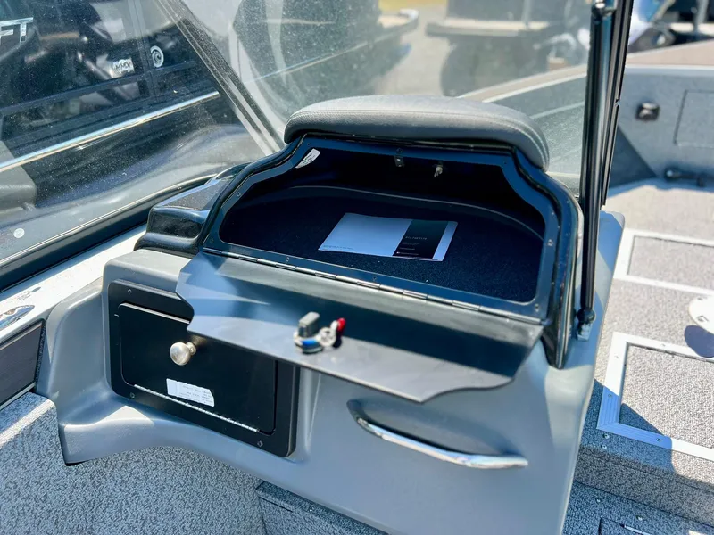 Slide: The Image of 2023 Starcraft Fishmaster 196 dashboard with steering wheel and control panel. - 14