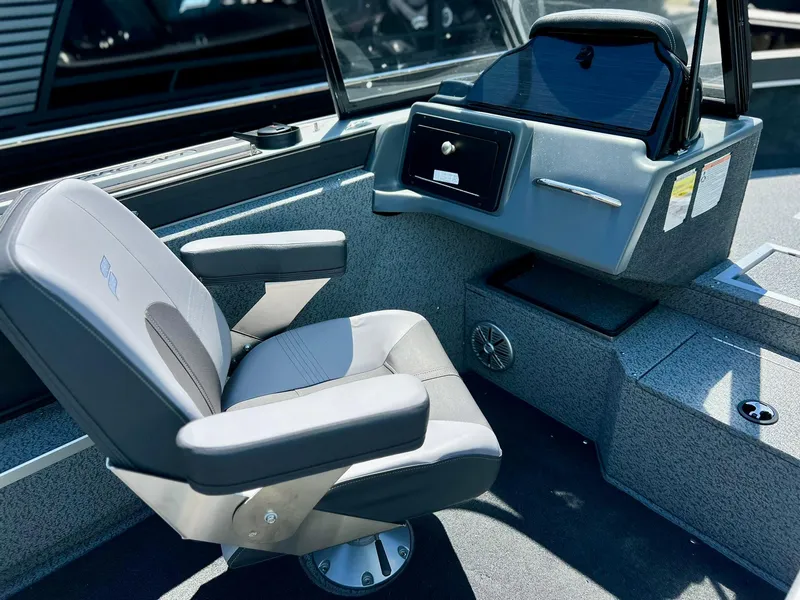 Slide: The Image of 2023 Starcraft Fishmaster 196 dashboard with steering wheel and gauges. - 16