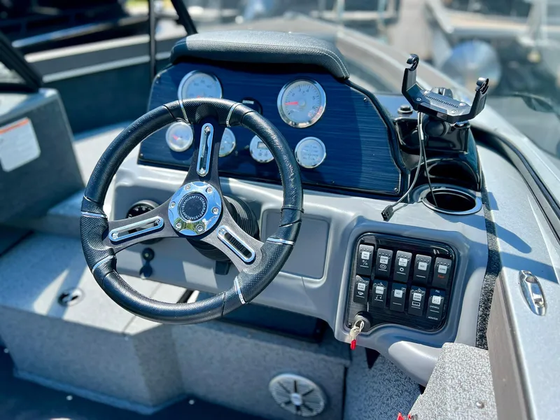 Slide: The Image of Interior of 2023 Starcraft Fishmaster 196 boat with dual seats and steering console. - 17