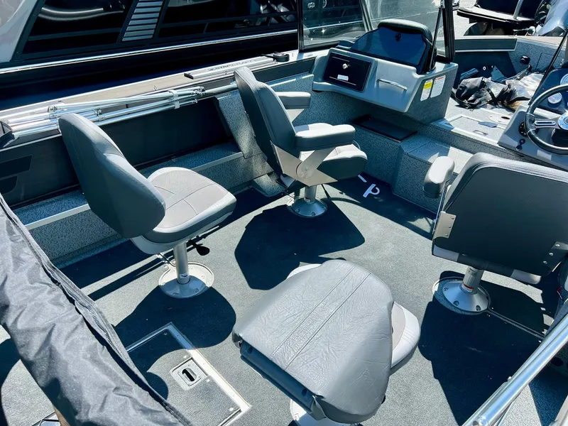 Slide: The Image of 2023 Starcraft Fishmaster 196 boat interior with four swivel seats and control console. - 3