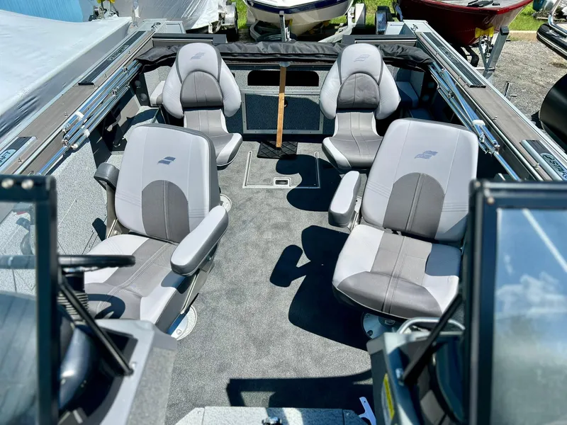 Slide: The Image of 2023 Starcraft Fishmaster 196 boat interior with four gray seats. - 4