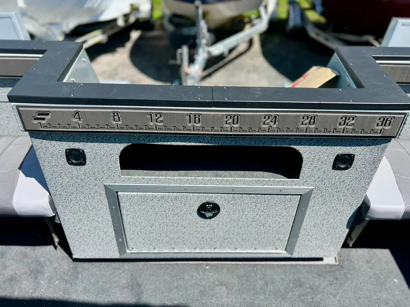Slide: The Image of 2023 Starcraft Fishmaster 196 boat console with built-in measuring ruler. - 5